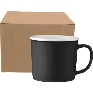 A black ceramic coffee mug with a white interior, placed beside a plain cardboard box.