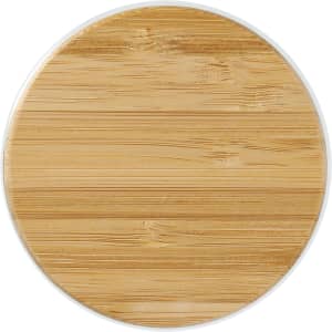A bamboo lid for a glass cup, featuring a smooth, natural wood grain texture in a circular shape.