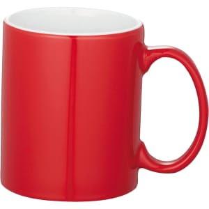 A ceramic mug in red with a white interior and a single handle. It is presented without any packaging.