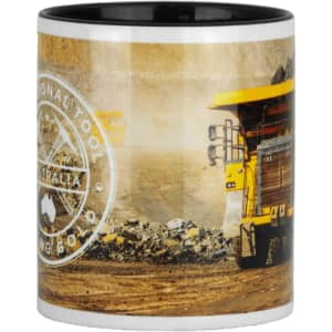 A ceramic mug with a black interior, featuring a construction vehicle design and a logo. The exterior showcases earthy tones.