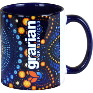 A ceramic coffee mug featuring a blue and white design with a vibrant, colourful pattern and a logo.