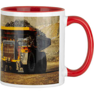 A ceramic mug featuring a red handle and interior, displaying an image of a mining dump truck.