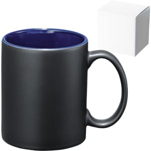 A ceramic mug with a matte black exterior and a glossy navy blue interior, accompanied by a white box.