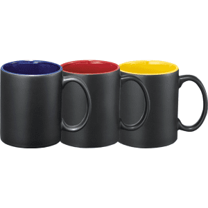 Three ceramic mugs in matte black with contrasting coloured interiors: blue, red, and yellow. Each mug has a handle.