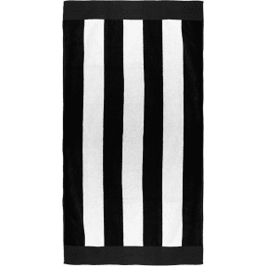 A striped beach towel featuring alternating black and white hues, with a border. It includes branding.