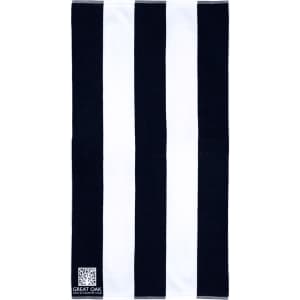 A cotton beach towel featuring a striped pattern in black and white, with a logo in the corner.