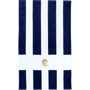 A beach towel with navy and white stripes, featuring a circular logo at the centre.