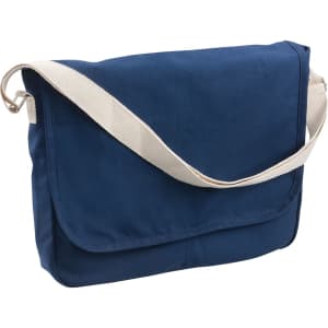 Canvas shoulder bag in navy blue with a cream strap and a flap closure. Includes a logo on the front.