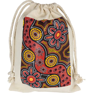 A cream-coloured drawstring bag featuring Indigenous artwork in vibrant reds, yellows, and blacks. It has a logo.