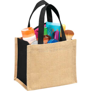 A jute tote bag with a black top and natural base, filled with various toiletries and a makeup brush, featuring a logo.