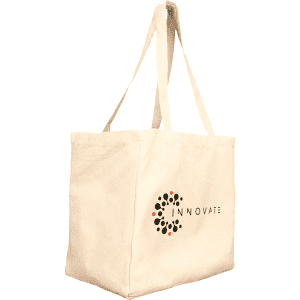 A cream reusable grocery tote bag with long handles and a logo on one side.