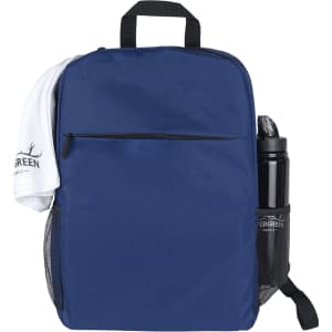 A navy backpack with a front zip pocket, a towel draped over the top, and a drink bottle in a side mesh pocket.