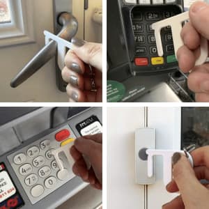 A white hygiene key designed for touch-free access on various surfaces. It features a simple, ergonomic shape.