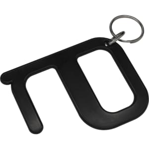 A black hygiene key with a keyring attachment, designed for contactless use. It has a simple, modern shape.