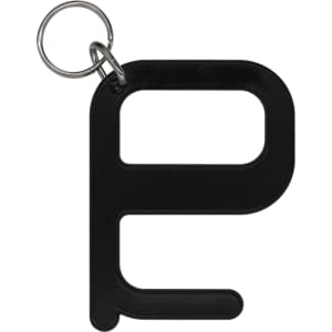A black hygiene key with a keyring attachment. The design features a simple shape.