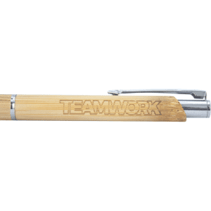 A bamboo ballpoint pen with a silver clip and engraved "TEAMWORK" on the barrel.