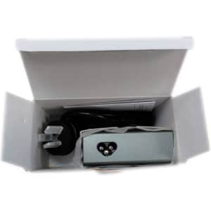 A USB smart charger in a grey casing, packed inside a white box with a plug and cables visible.