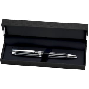 A pen with a sleek silver finish inside a black pen box, featuring an interior lining and a branding logo.