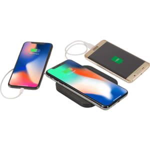 A wireless charging pad with dual outputs, featuring multiple smartphones in use, displayed in black with a sleek design.
