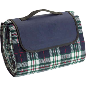 A rolled picnic rug with a checkered pattern in green, white, red, and navy, featuring a handle for portability.
