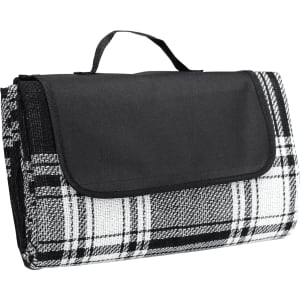 A folded picnic rug in a black and white check pattern with a black handle for easy carrying.