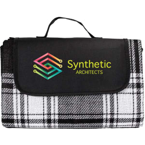 A picnic rug featuring a black and white tartan pattern with a logo on the front. It has a convenient carry handle.