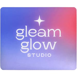 A mouse pad featuring a gradient design in purple and pink with a logo in the centre.