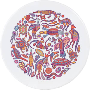 A circular ceramic coaster featuring vibrant Aboriginal-style artwork with various animal motifs and intricate patterns.