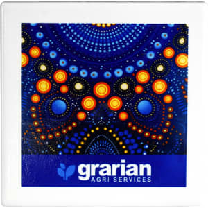 A square ceramic coaster featuring a vibrant blue design with orange and yellow dots, alongside branding.