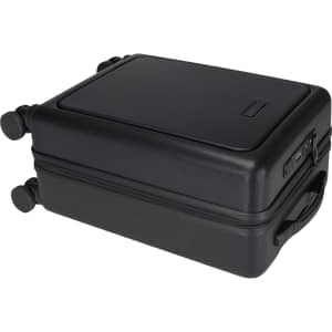 A black wheeled cabin trolley with a hard exterior, featuring a handle and two wheels for easy transport.