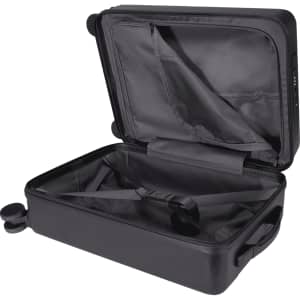 A black wheeled cabin trolley bag with a spacious interior and straps for securing items inside. Features a logo.