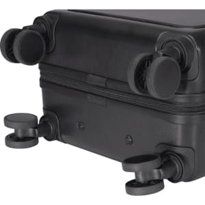 A black wheeled cabin trolley with smooth-rolling wheels and a sturdy zipper closure. It features a simple, sleek design.