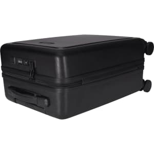 A black wheeled cabin trolley with a sturdy handle, featuring a zip closure and two wheels for easy transport.