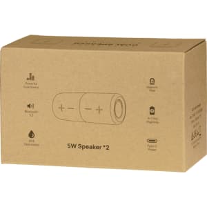 A brown cardboard box containing a Breakaway Bluetooth speaker, featuring a logo and illustrations of its features.