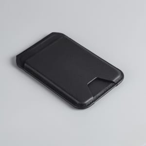 A black magnetic wallet with a slim design, featuring a phone stand and a branding logo on the surface.
