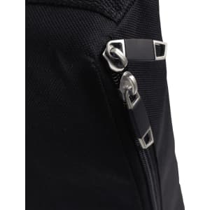 A close-up of a black fabric with a silver zipper and metal accents, featuring a sleek, modern design.