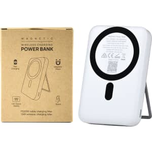 A white magnetic power bank with a phone stand and LED display, displayed alongside its packaging.