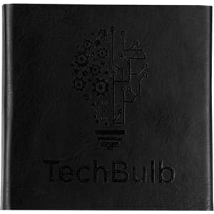 A black notebook features an embossed light bulb design incorporating gears and circuits, with a logo at the bottom.