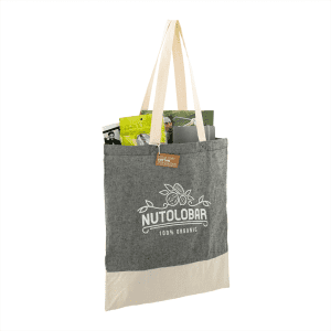 A grey and cream tote bag made from recycled cotton twill, featuring a logo and filled with various items.