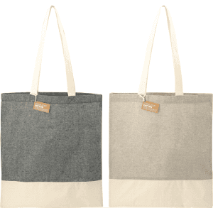A recycled cotton twill tote in dark grey and light beige, featuring contrasting bottom panels and handles.