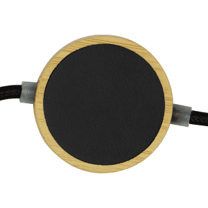 A round black charging pad with a bamboo border and a braided cable, designed for wireless charging.