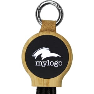 A circular keyring made of bamboo with a black insert and a charging cable attached. The keyring features a logo.