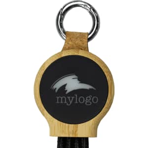A round, black and bamboo keychain featuring a keyring attachment and a logo on the front.