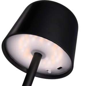 A black mini rechargeable lamp featuring a cylindrical shade and a circular light base, with a charging port visible.