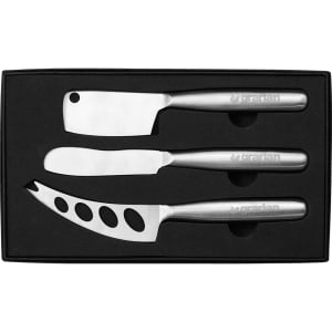 A stainless steel cheese knife set featuring three different knives in a black presentation box.