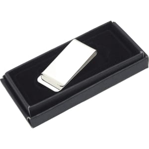 A silver metal money clip displayed in a black gift box with a velvet interior.