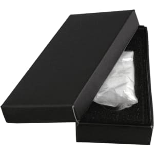A black gift box partially open, revealing a white item inside, set against a plain background.