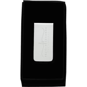 A sleek metal money clip in a black velvet presentation box, with a reflective surface and a subtle logo.