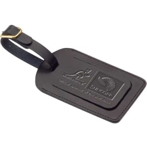A black covered luggage tag with a leather finish and two logos embossed on the surface.