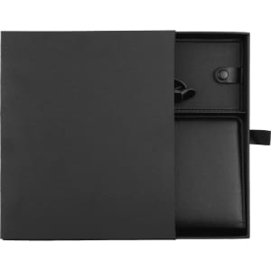 A black leather travel gift set, featuring a wallet and a travel organiser, presented in a sleek box.